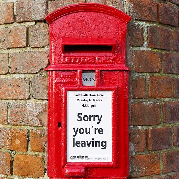 Sorry you’re leaving British post box on brick wall