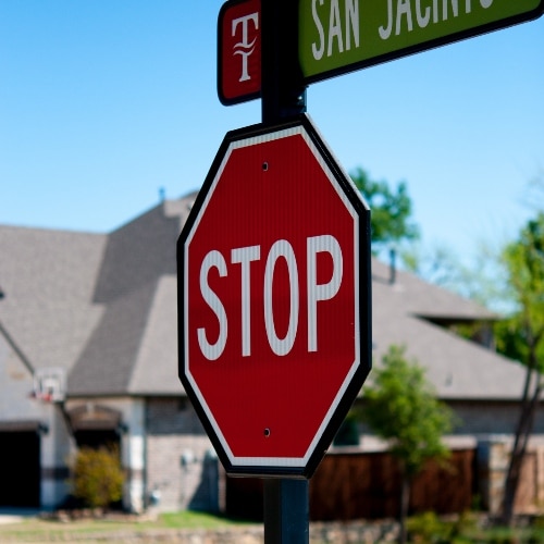 MUTCD compliant stop sign in front of house