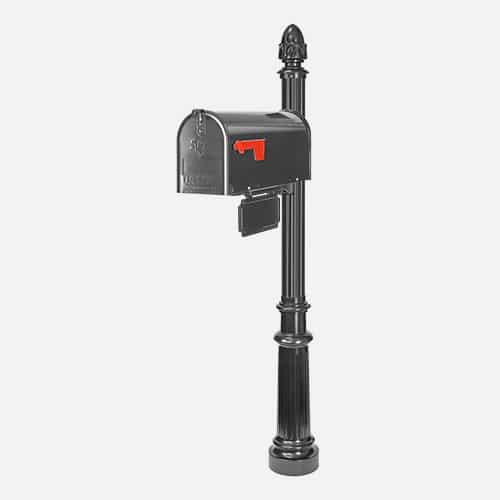 Single steel mailbox unit on round pole with address plaque and acorn finial. Brandon Industries model FAC36-AM33-9X.