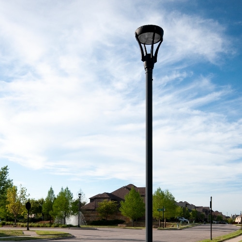 modern LED post lamp next to residential community road