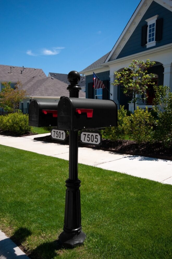 Two residential round top mailboxes.