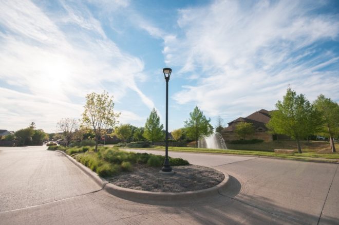 Modern lamp post on residential community road.