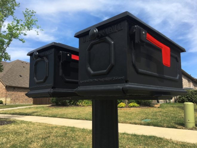 Two residential square mailboxes.