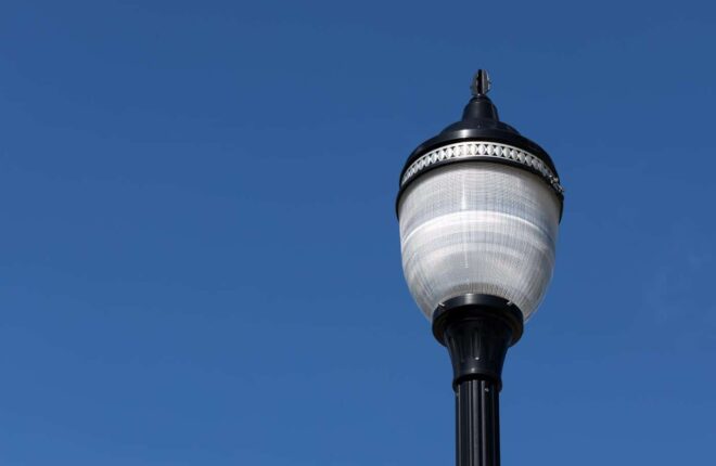 LED traditional post-top luminaire with a type V prismatic globe.