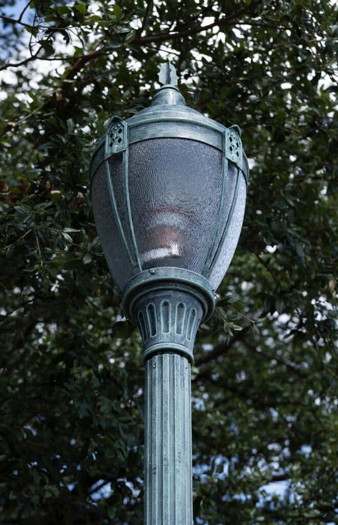 Traditional post-top luminaire with a round fluted pole, AGA1A Series.