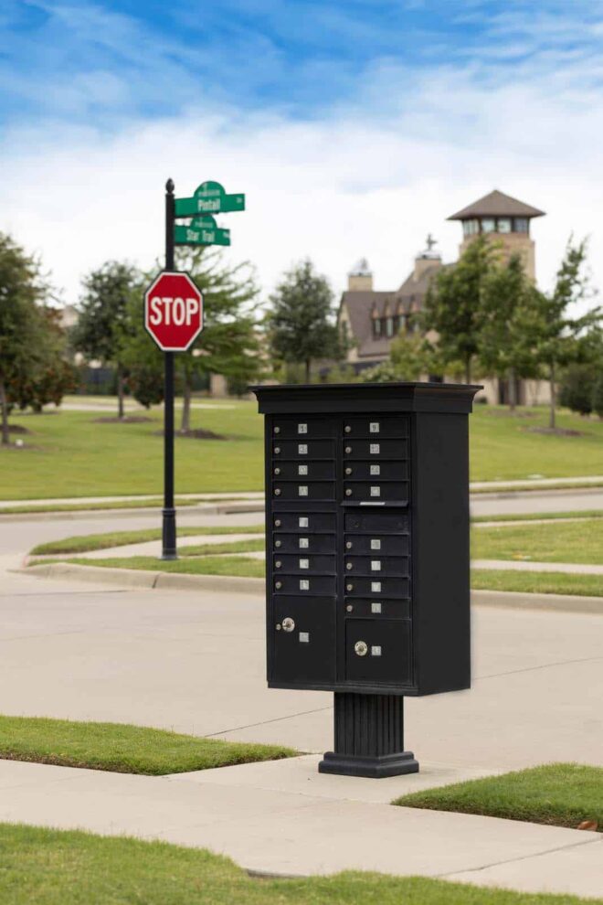 Cluster box unit in the foreground with a street sign in the background.