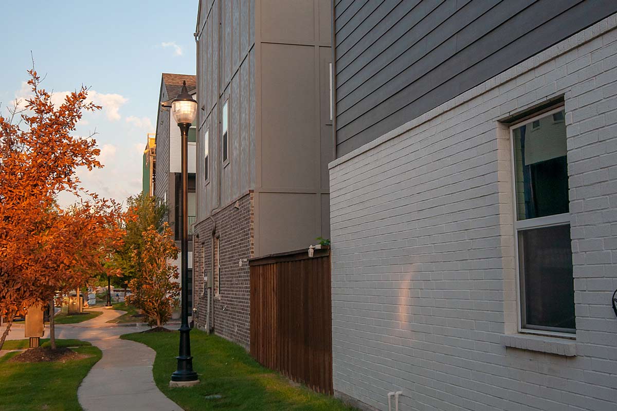 Details matter when selecting streetscape fixtures A street lamp by a path outside of a condo.