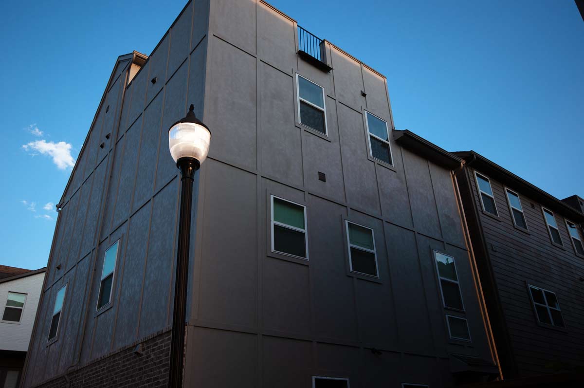 Revitalizing downtown with decorative streetlamps A decorative street lamp stands outside of a downtown building
