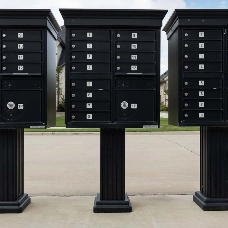 Three classic cluster box mail units in a row